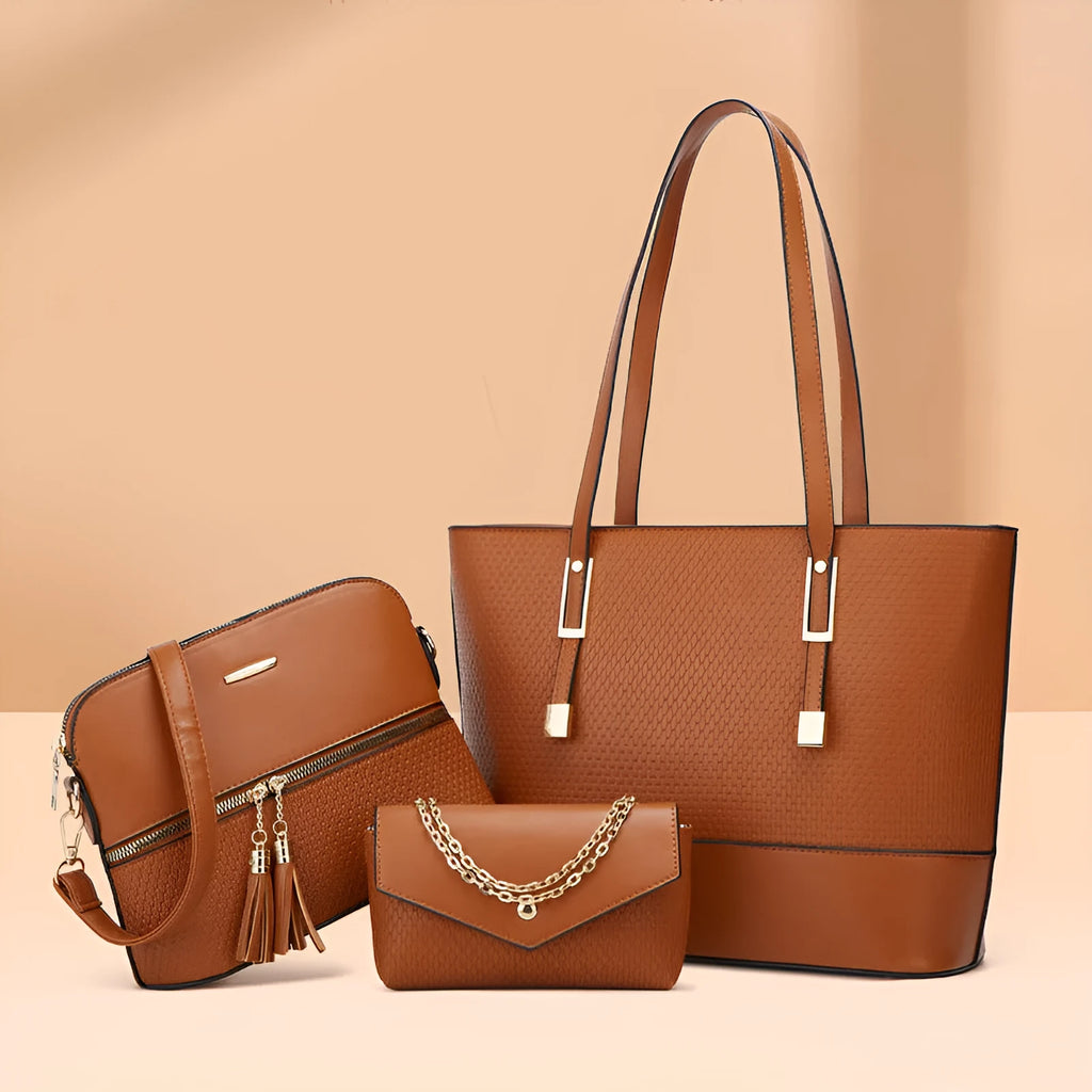 Three women's shoulder bags in black, brown, and light gray colours with folding design and PU material