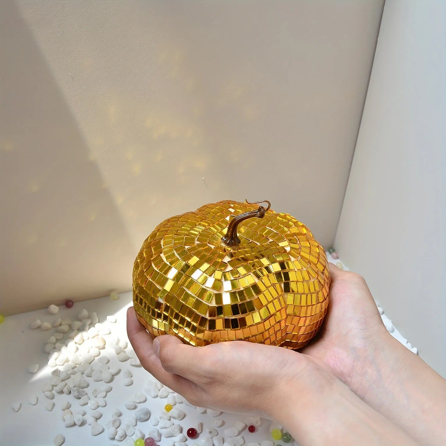 A Chinese-style glass pumpkin ornament with a mirror finish, shown in one of five available sizes.