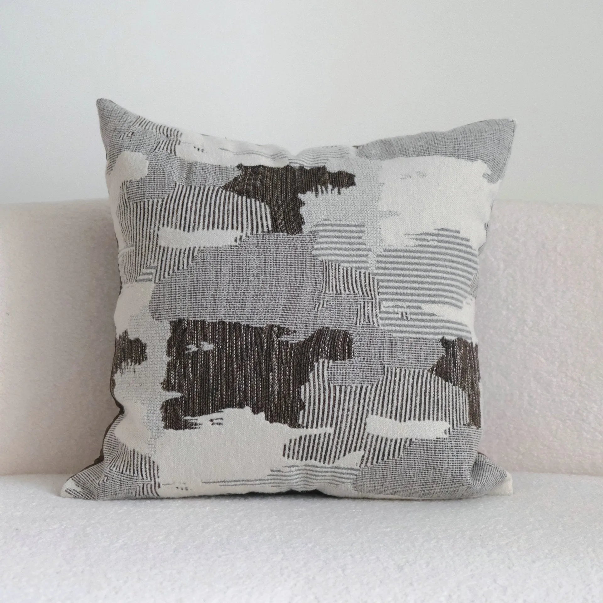 Coffee brown striped Chinese classical style cushion pillow on a sofa in 45x45cm size.