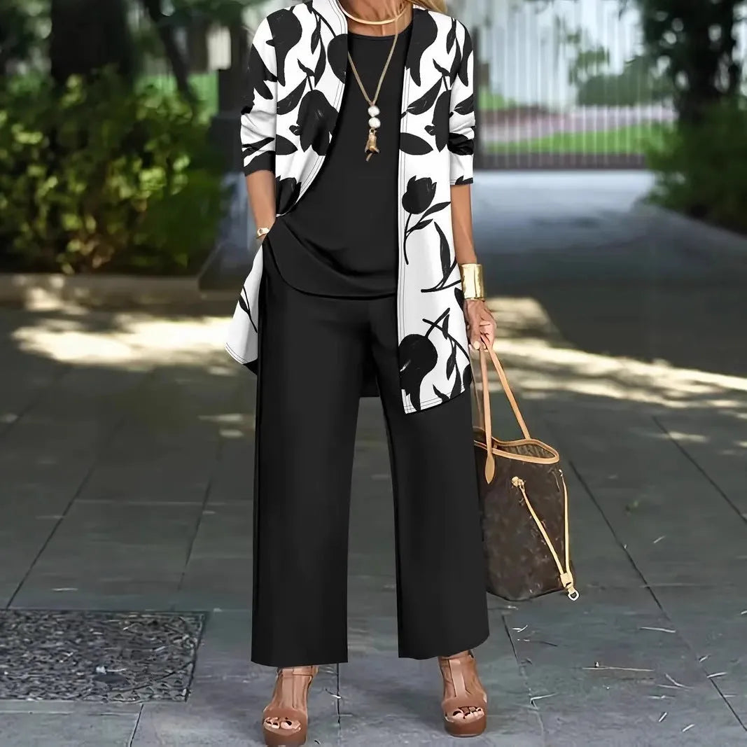 Women's blue three-piece casual suit comprising a long-sleeve coat, a vest, and trousers on a hanger.