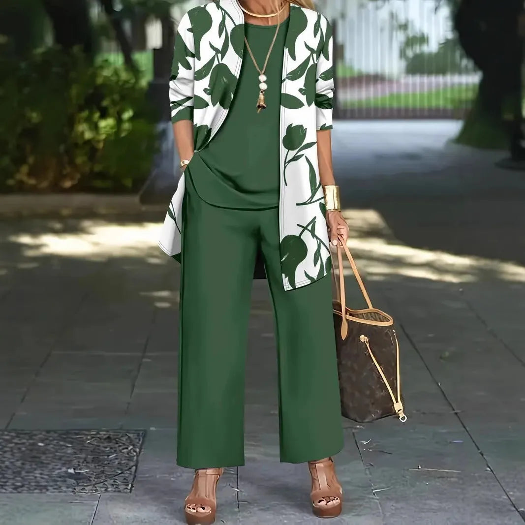 Women's blue three-piece casual suit comprising a long-sleeve coat, a vest, and trousers on a hanger.