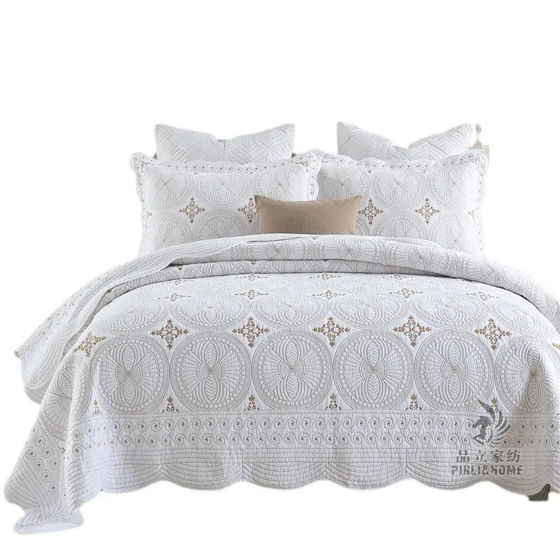 European-style pure cotton embroidered bed cover set with two pillowcases on a bed