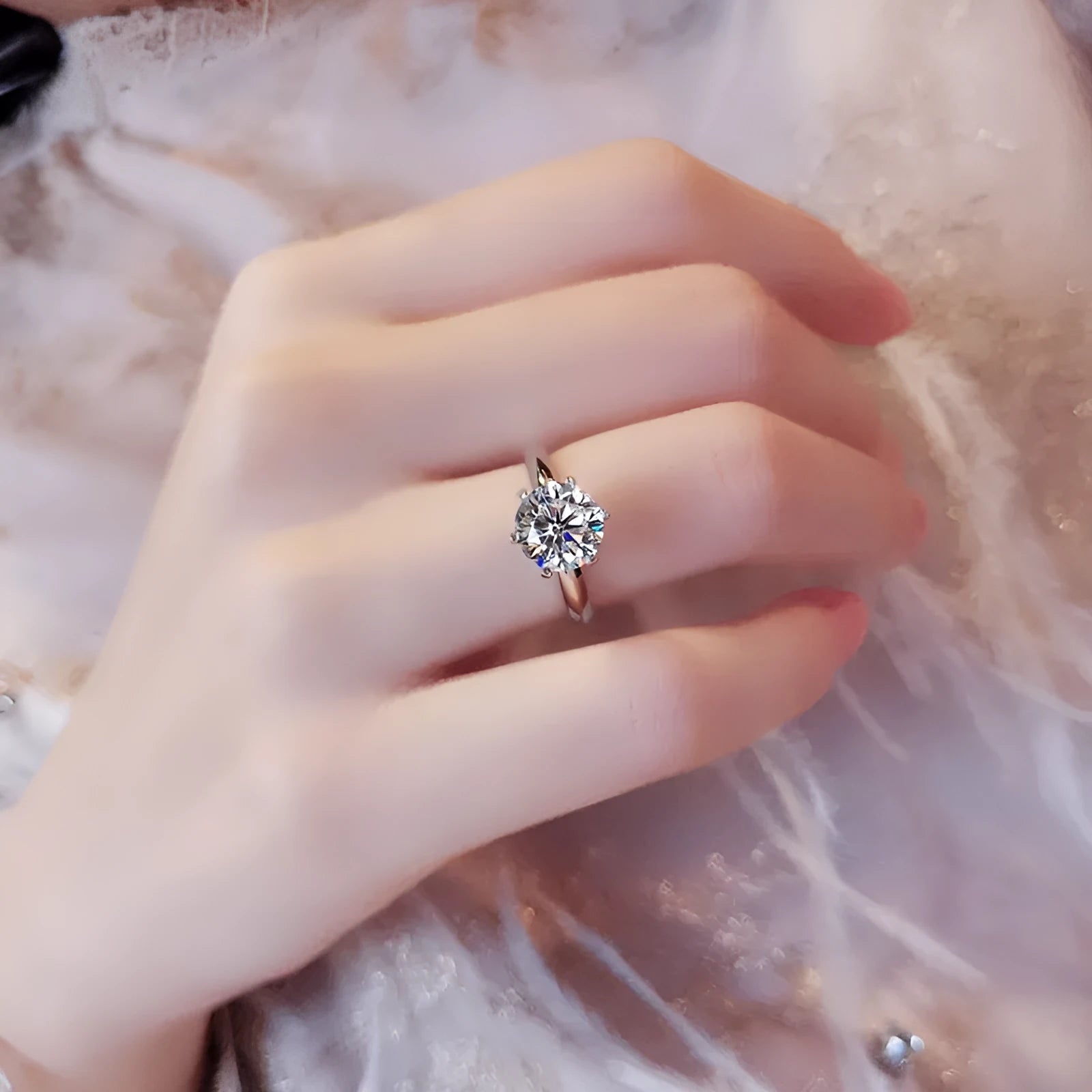 White gold plated women's ring with a geometric design and a six-claw set zircon stone.