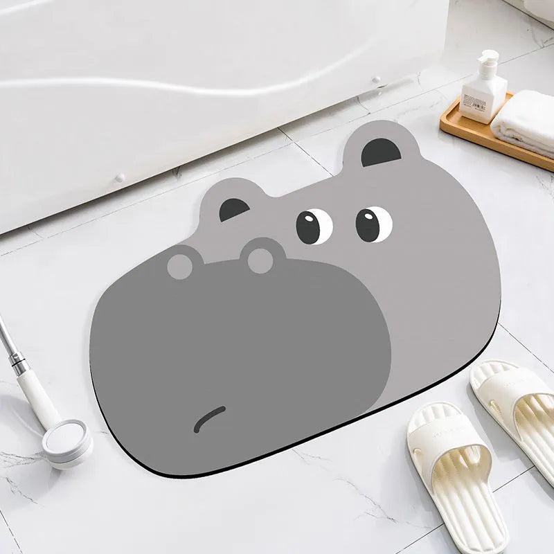 Cartoon animal diatomite bathroom mat in alien shape on tiled floor.