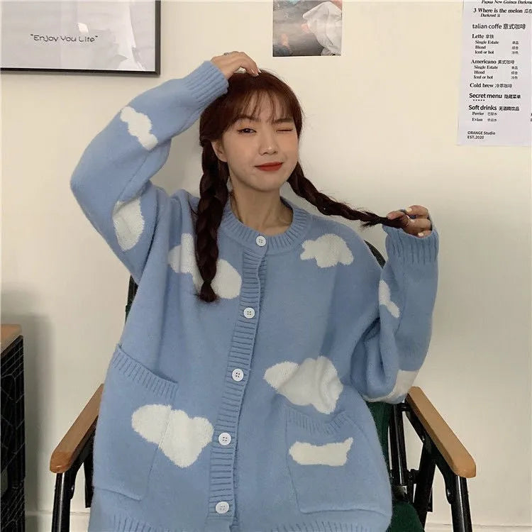 Blue women's cardigan with white cloud pattern, loose fit and long sleeves.
