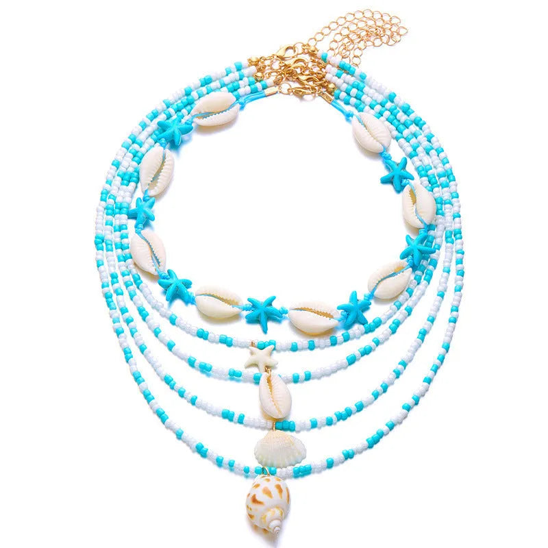 Five multi-layer beaded necklaces with starfish and shell charms in blue and colours