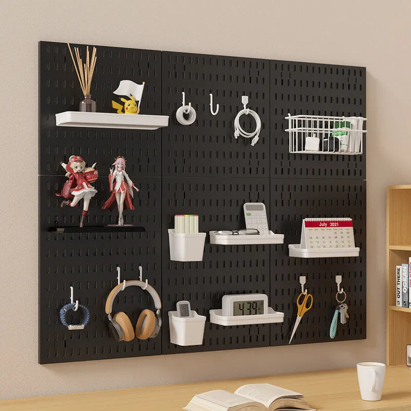 White plastic punch-free wire-wrap board organising cables on wall with modular panel design