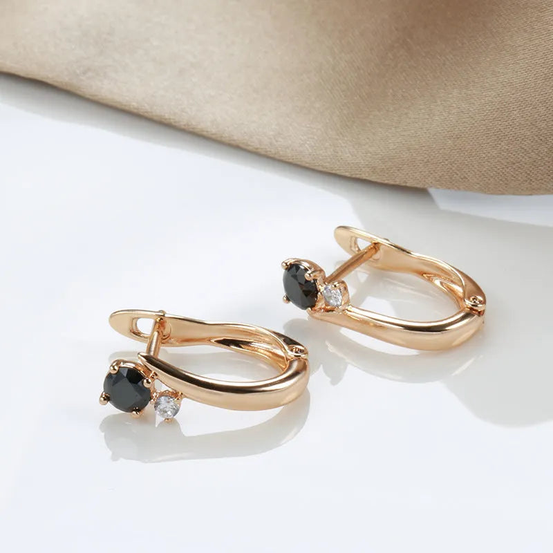 Women's black agate earrings with gold-plated finish and geometric drop shape design