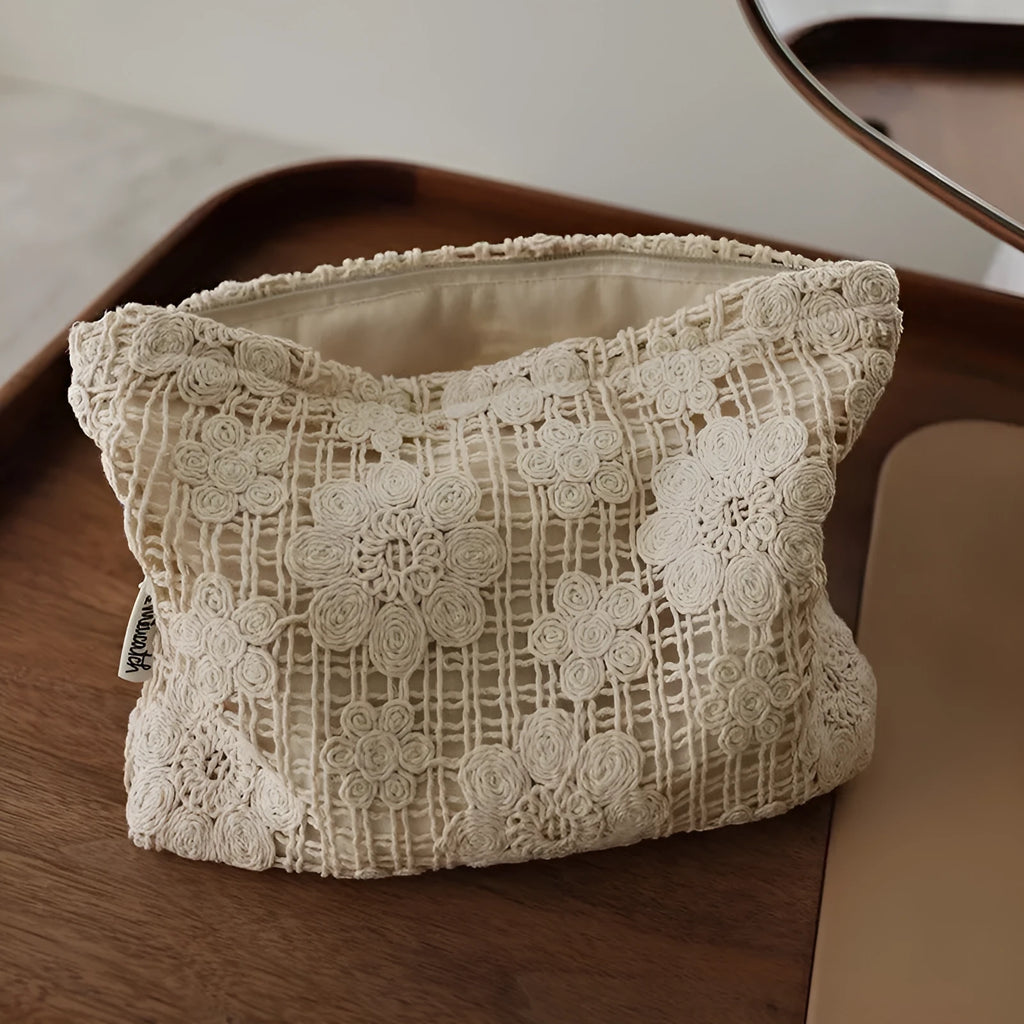 Handmade crocheted hollow flower cosmetic bag with ethnic embroidery on corduroy fabric
