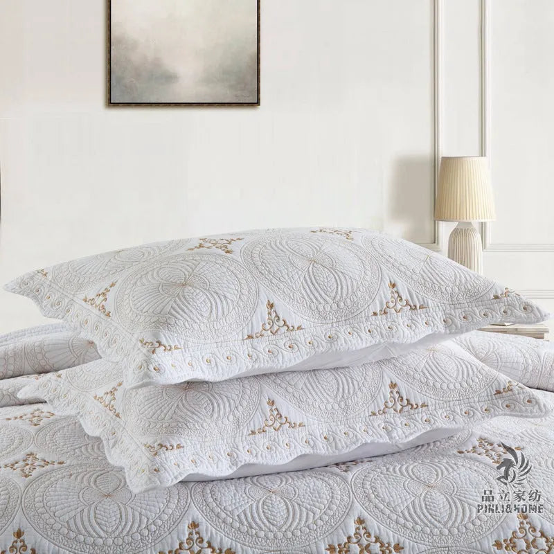 European-style pure cotton embroidered bed cover set with two pillowcases on a bed
