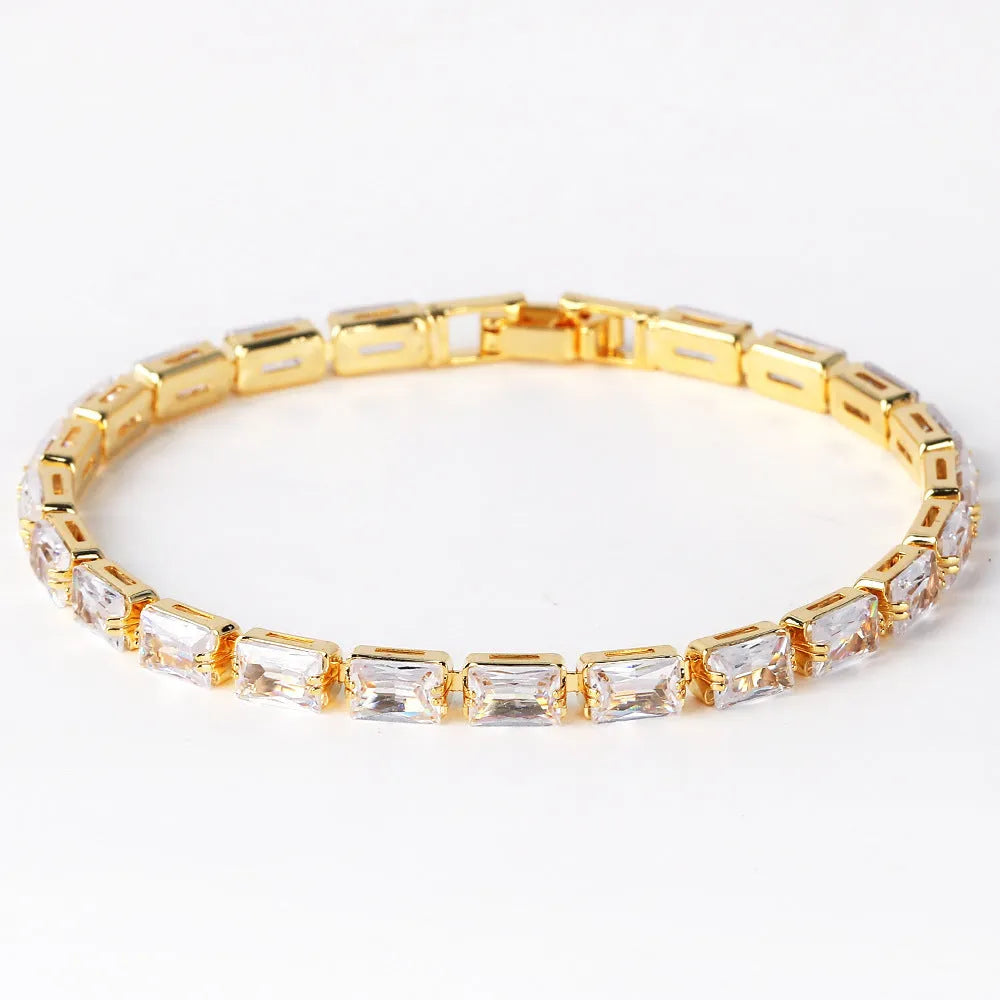 Adjustable electroplated zircon bracelet in gold finish with coloured zircon accents