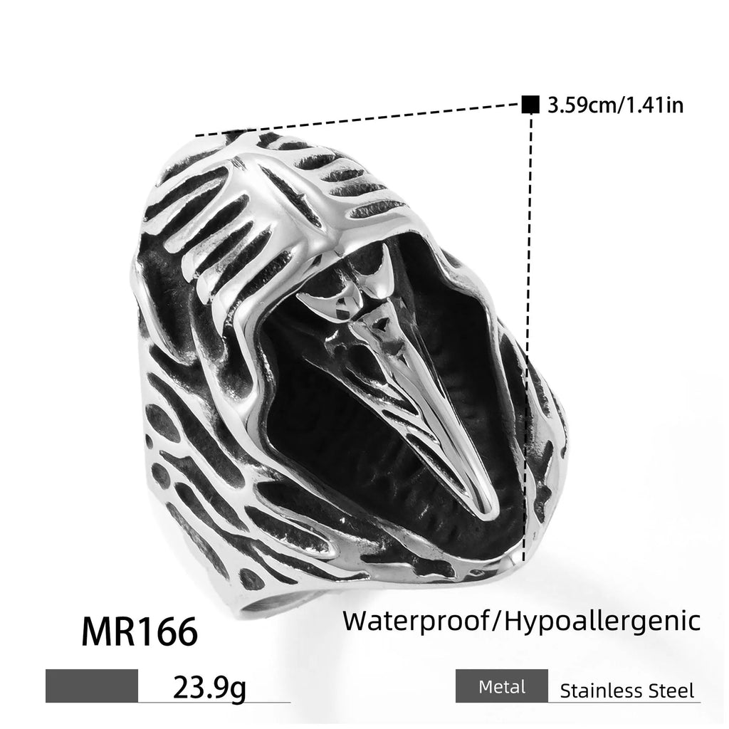 Geometric titanium steel crow ring in a punk retro style on a grey background.