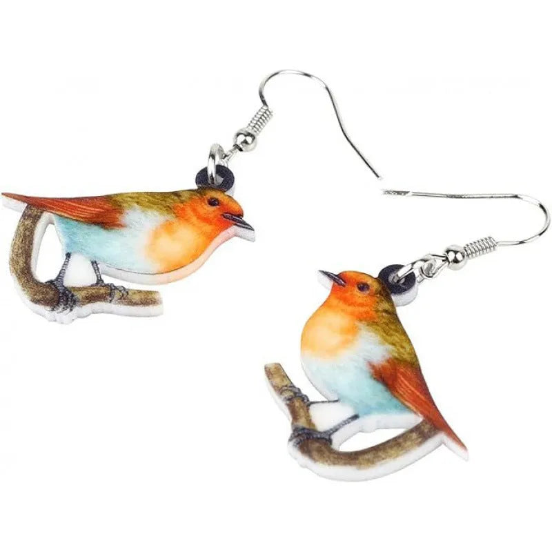 Blue Titmouse pendant earrings with geometric and snake designs on acrylic