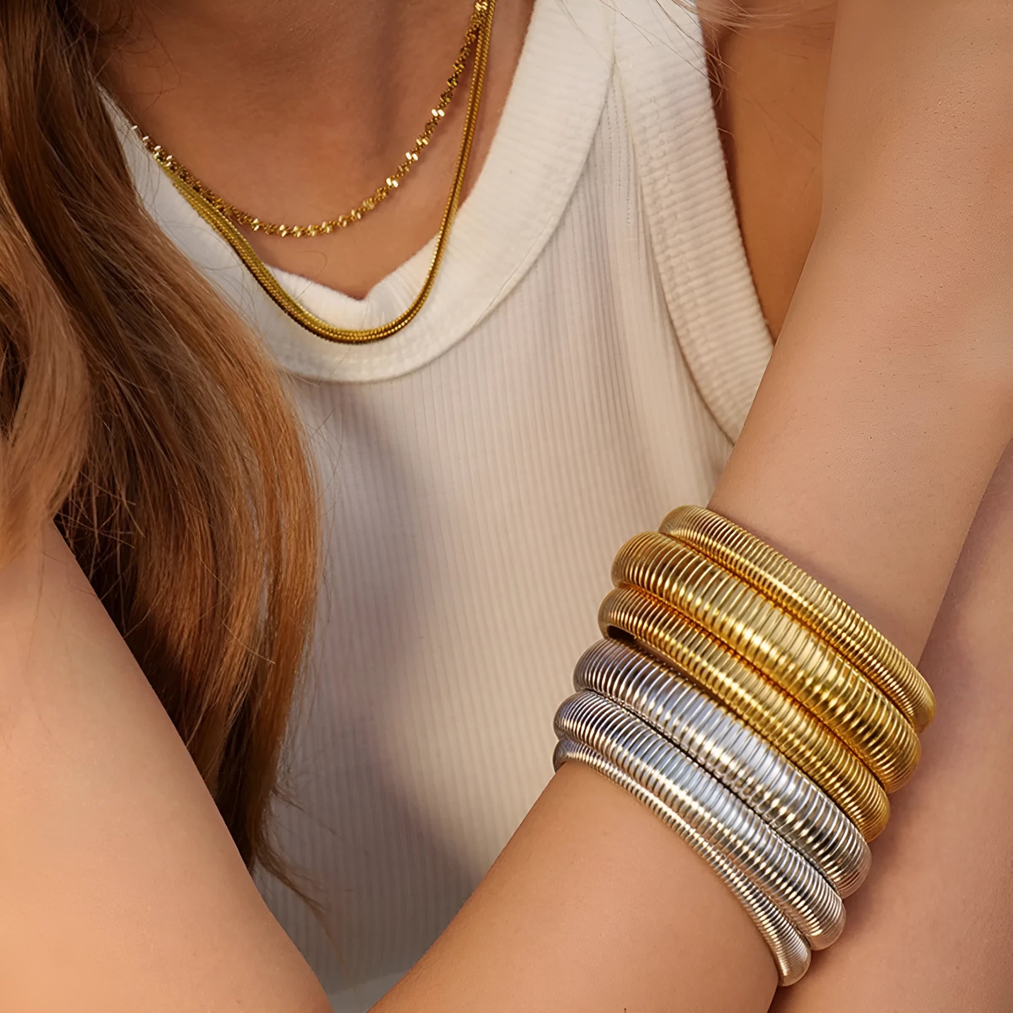 Women's titanium steel bracelet with vertical stripe pattern in gold or silver finish