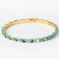 Adjustable electroplated zircon bracelet in gold finish with coloured zircon accents