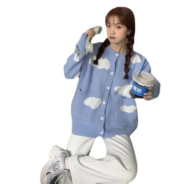Blue women's cardigan with white cloud pattern, loose fit and long sleeves.