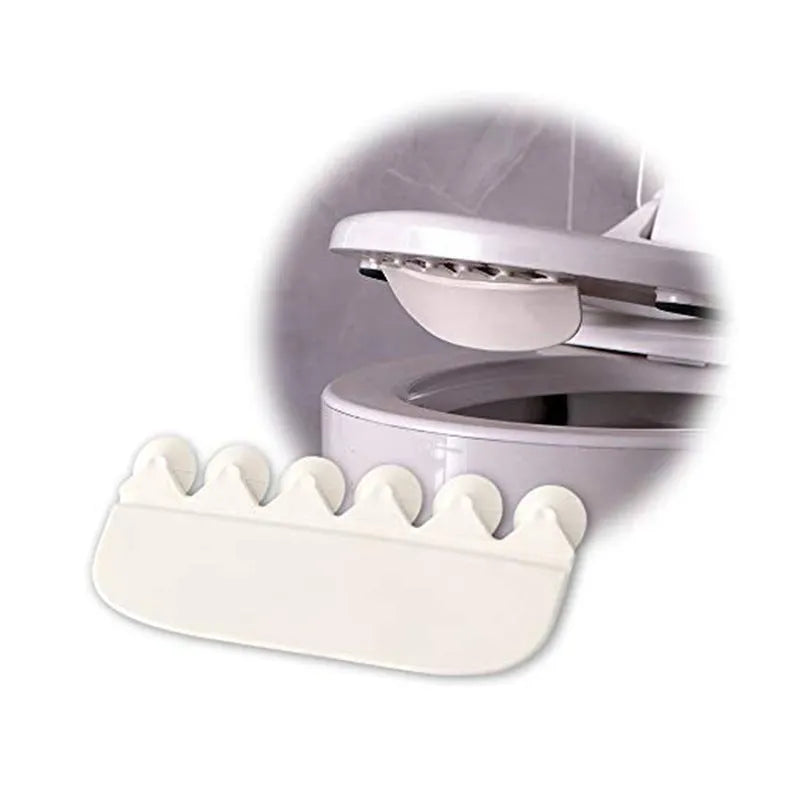White PVC toilet training splash guard for children placed on toilet seat