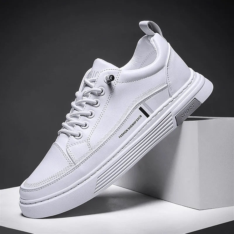 Men's white low-top skate shoes with a microfiber upper and elastic band, shown on a grey background.