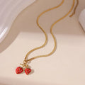 Stainless steel strawberry fruit pendant necklace on an alloy chain, shown in red and white gradient colour options.