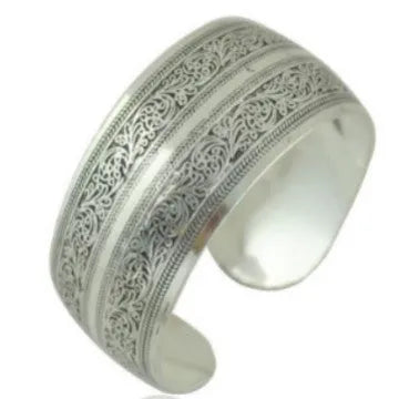 Open carved Miao silver alloy bracelet with elephant and turtle motifs on a Roman-shaped band.