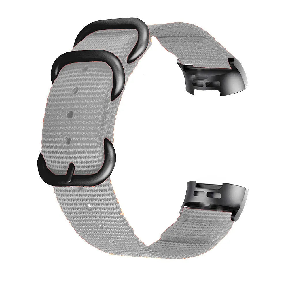 Nylon three-ring buckle replacement strap for Fitbit Charge fitness trackers in multiple colours.