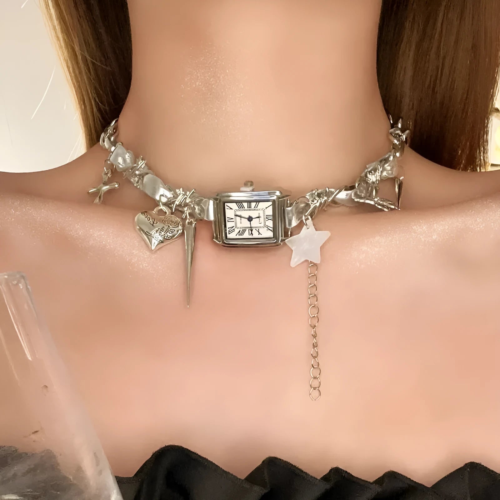 Dark electroplated multi-layer cross necklace with twin clavicle chains on display