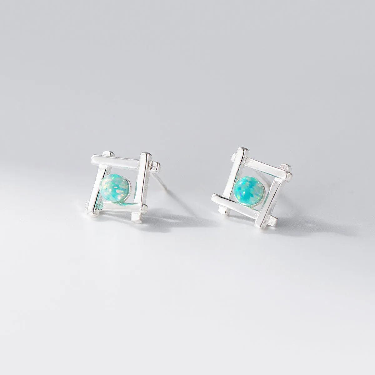 Geometric cross quadrangle stud earrings in 925 silver with silver and gold tone options