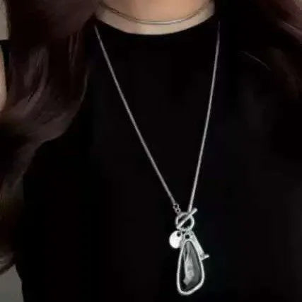 Long geometric sweater chain necklace with alloy water drop pendant on snake bones chain.