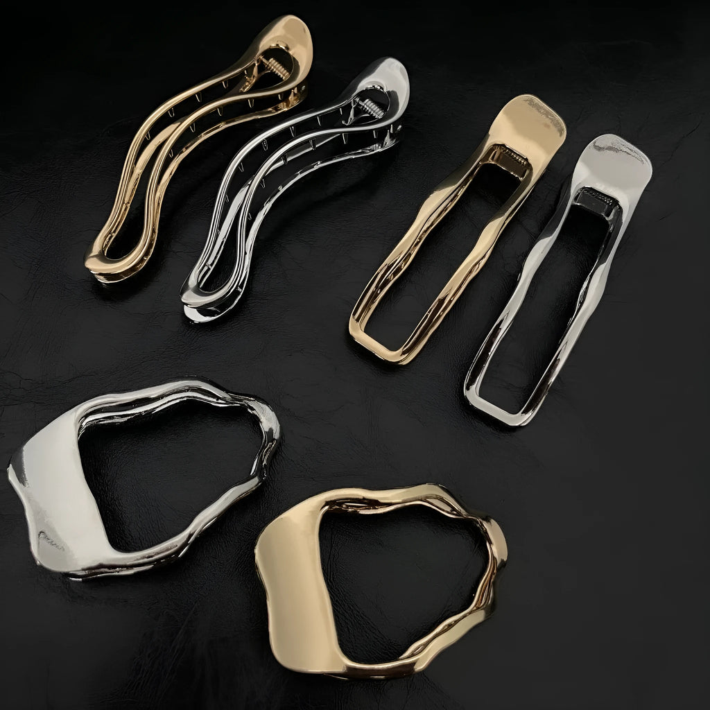 Gold and silver zinc alloy hair clip barrettes in arc, square, and triangle shapes.