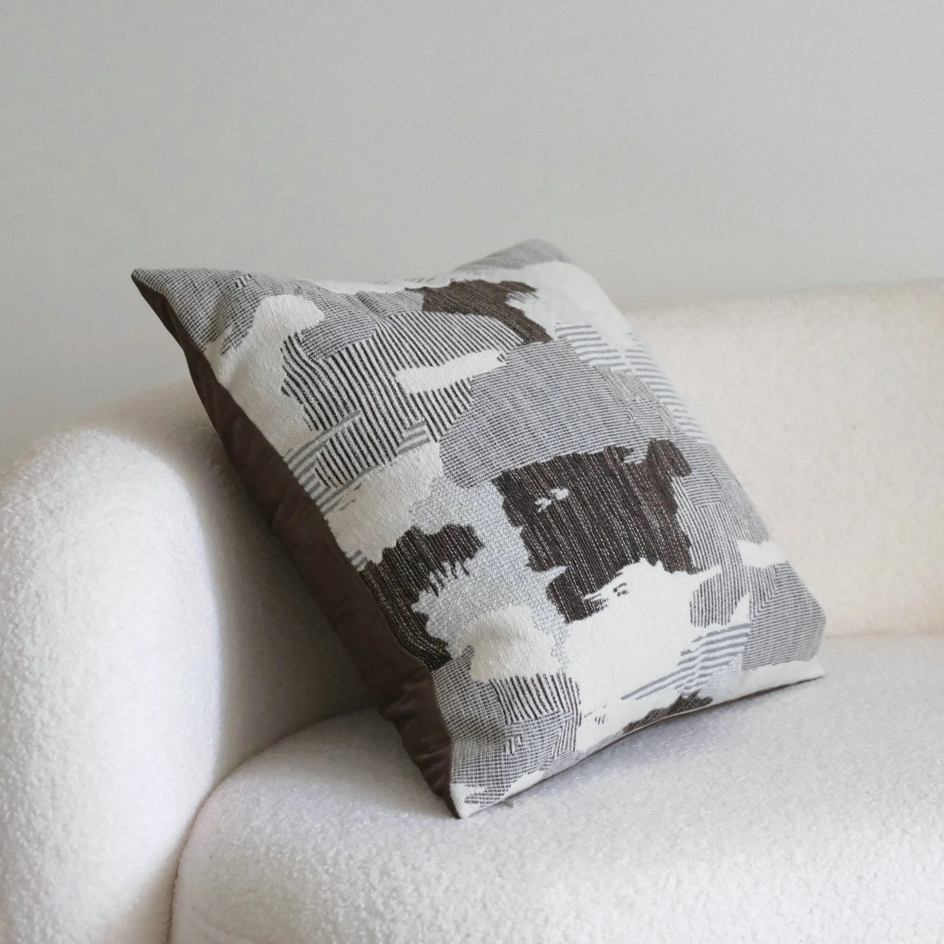 Coffee brown striped Chinese classical style cushion pillow on a sofa in 45x45cm size.