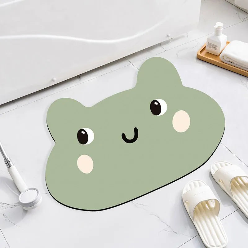 Cartoon animal diatomite bathroom mat in alien shape on tiled floor.