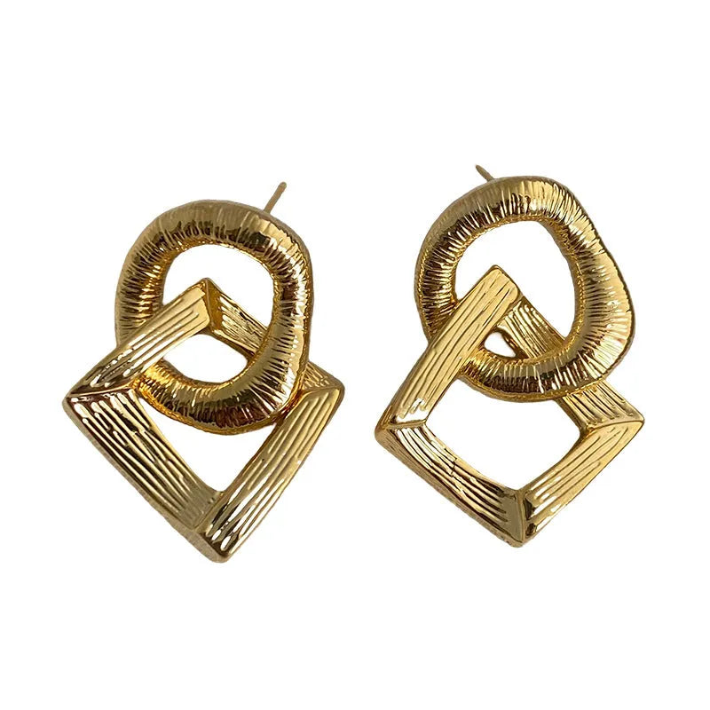 Geometric circle pendant earrings with gold electroplated finish showing 3.4 cm height measurement