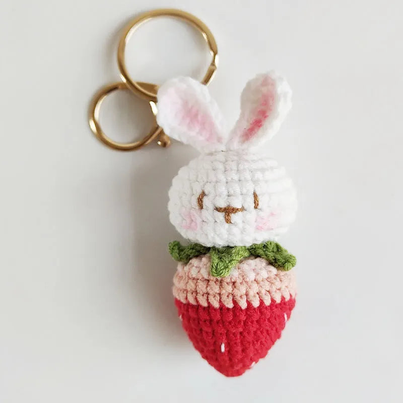 White hand-woven wire pendant with cartoon rabbit strawberry design and attached metal key
