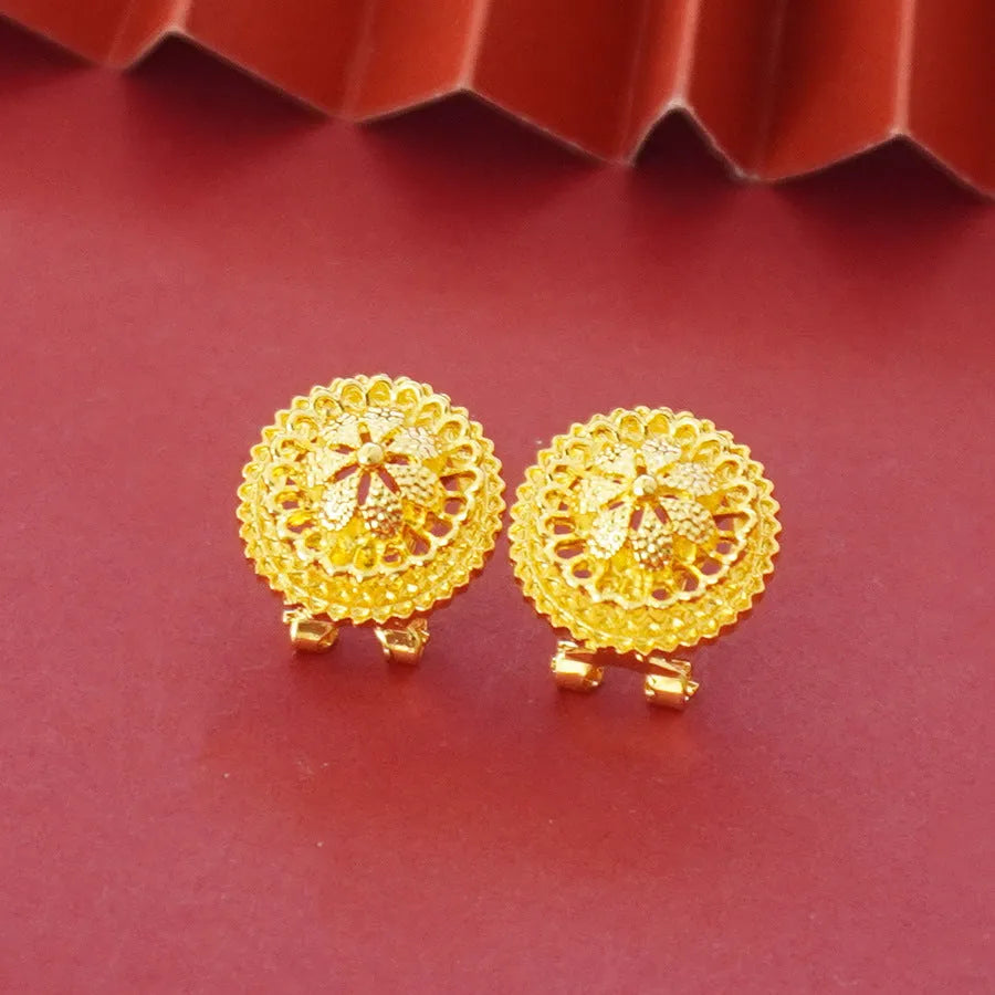 Women's three-piece jewellery set showing gold electroplated necklace with floral pendant, matching earrings, and ring with Middle Eastern design