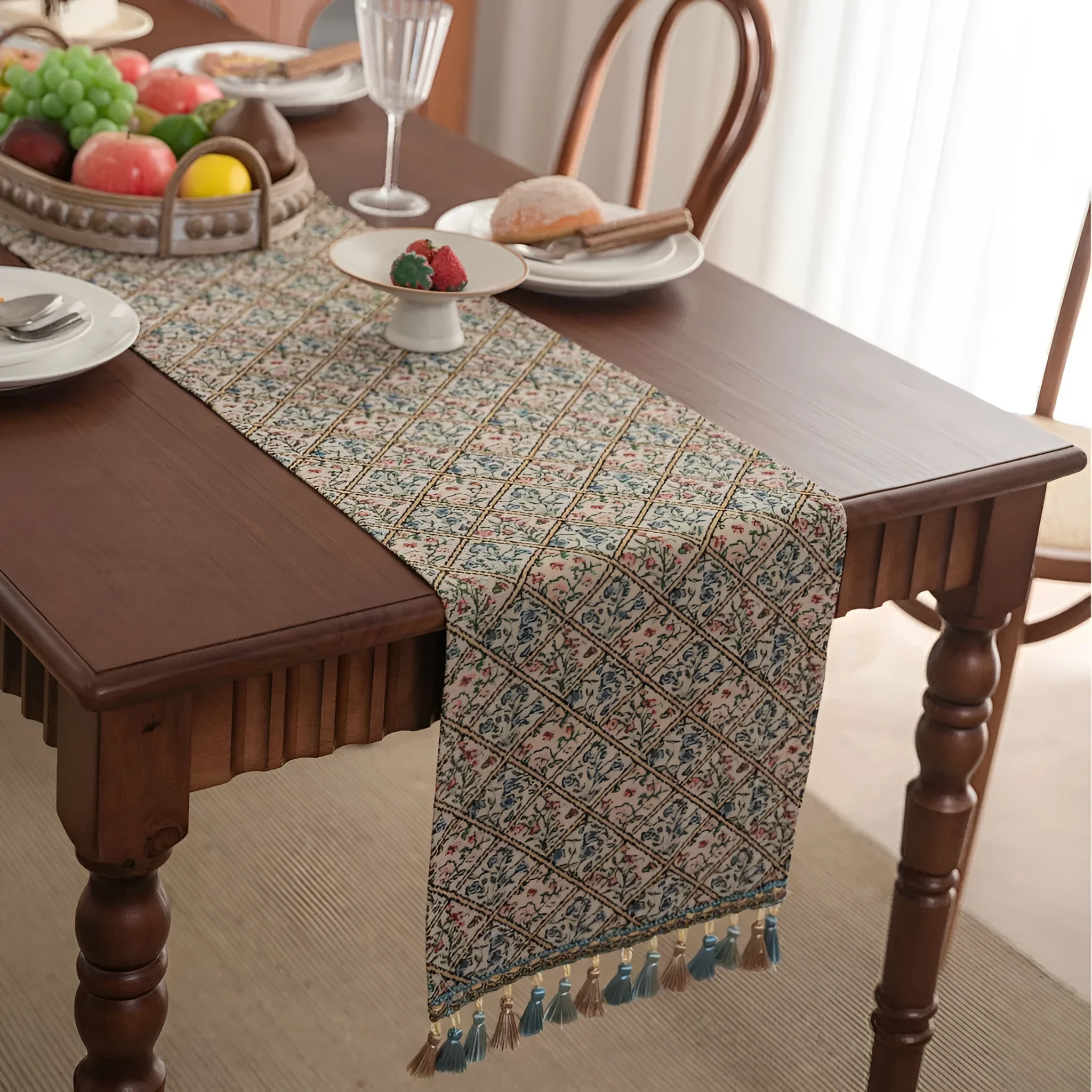Nordic jacquard bouquet pattern table runner with decorative tassel trim in dark blue colour