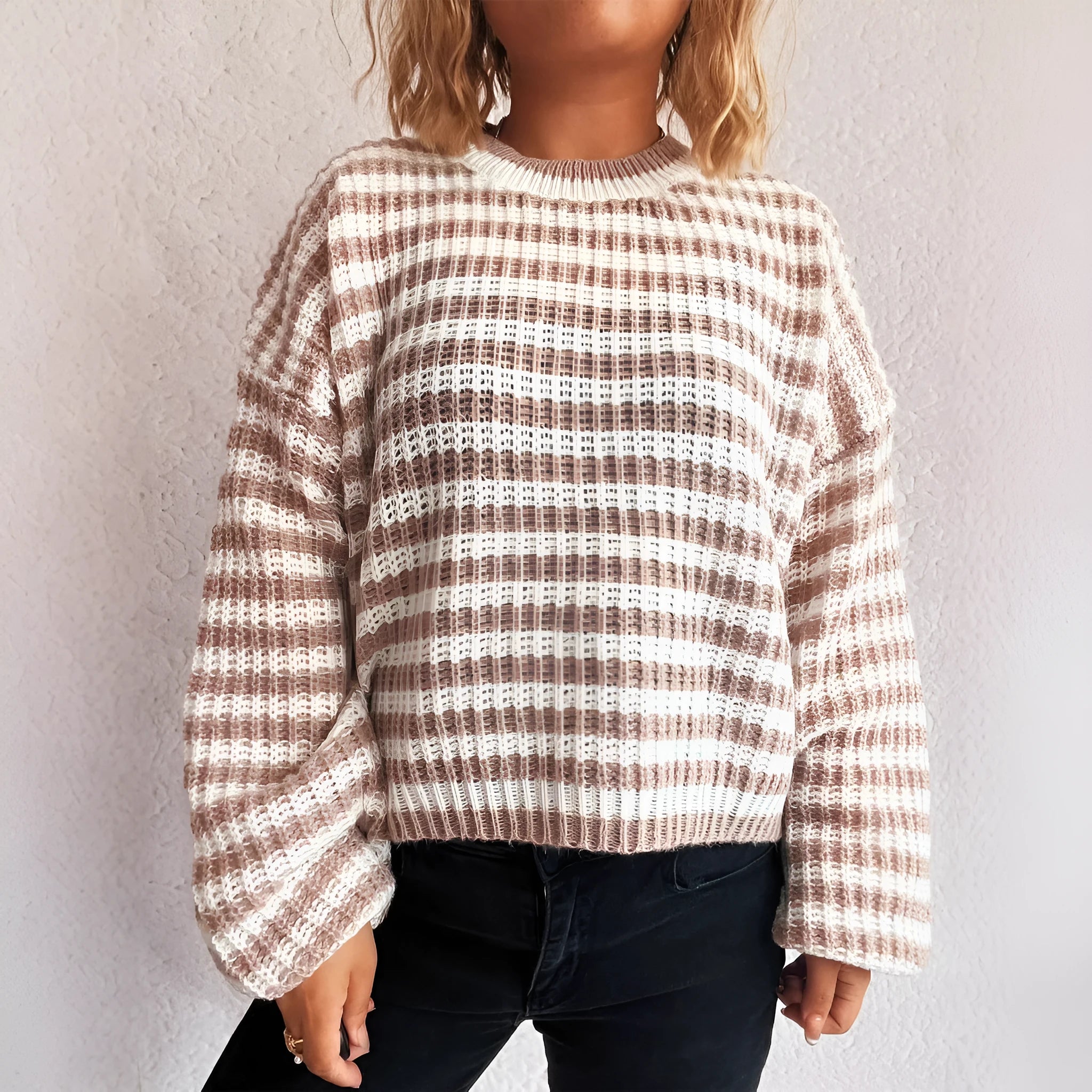 Women's striped loose pullover sweater in polyester knit with round neck and long sleeves