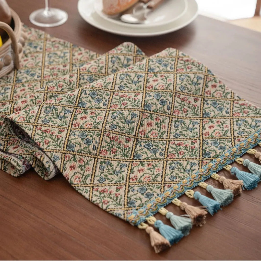 Nordic jacquard bouquet pattern table runner with decorative tassel trim in dark blue colour