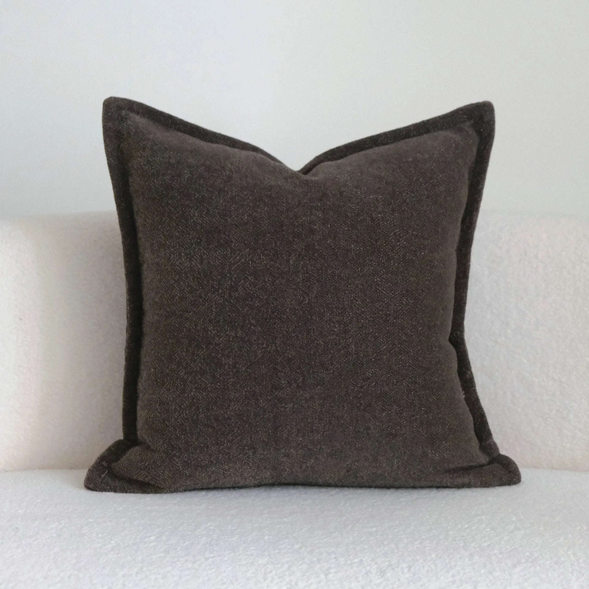Coffee brown striped Chinese classical style cushion pillow on a sofa in 45x45cm size.