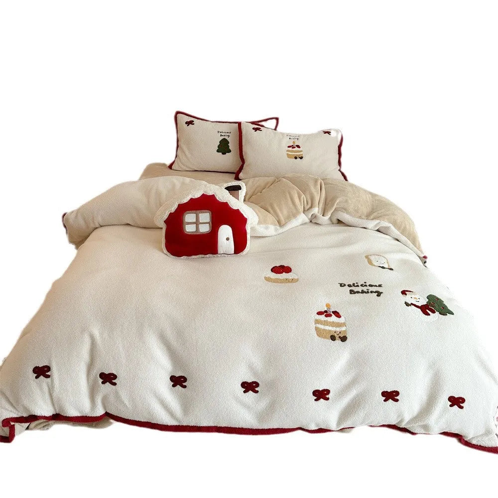Winter Christmas cartoon bedding four-piece set with snowman and heart pattern on duvet cover and pillowcases.