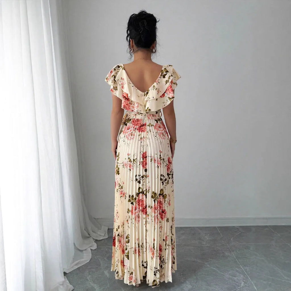 Apricot floral print women's dress with V-neck, ruffled sleeves, and oversized swing skirt