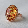 Genuine amber beeswax ring with ethnic style details in New Amber Type A colour on alloy band