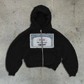 A loose fit black hoodie jacket with a front zipper, pockets, and a white letter print design.