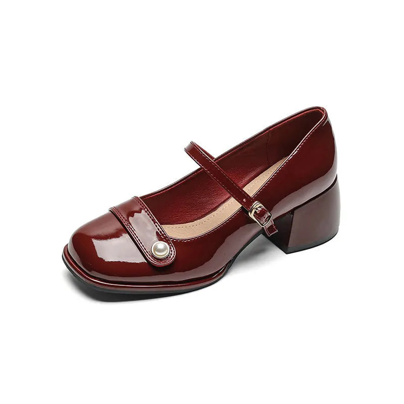 Women's patent leather ankle boots with chunky heels and buckle fastening in black colour