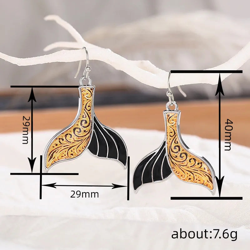 Women's retro style fishtail earrings with whale design in white gold colour