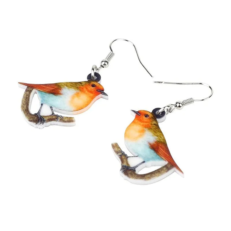 Blue Titmouse pendant earrings with geometric and snake designs on acrylic