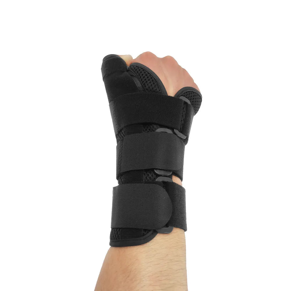Carbon fibre reinforced sports wrist guard with thumb strap shown in black with grey edging