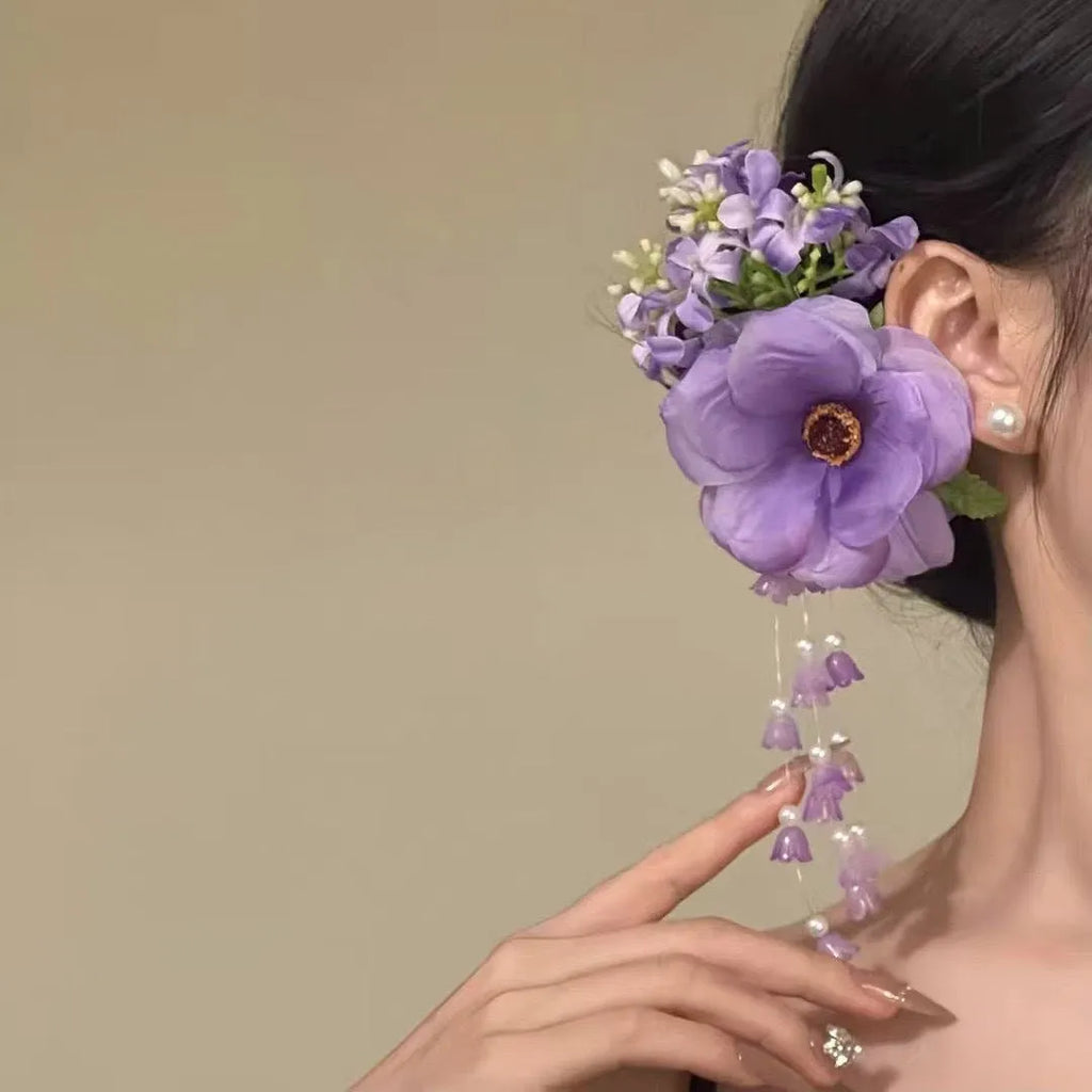 Yellow tassel side clip hair accessory with flower and pearl decorative elements