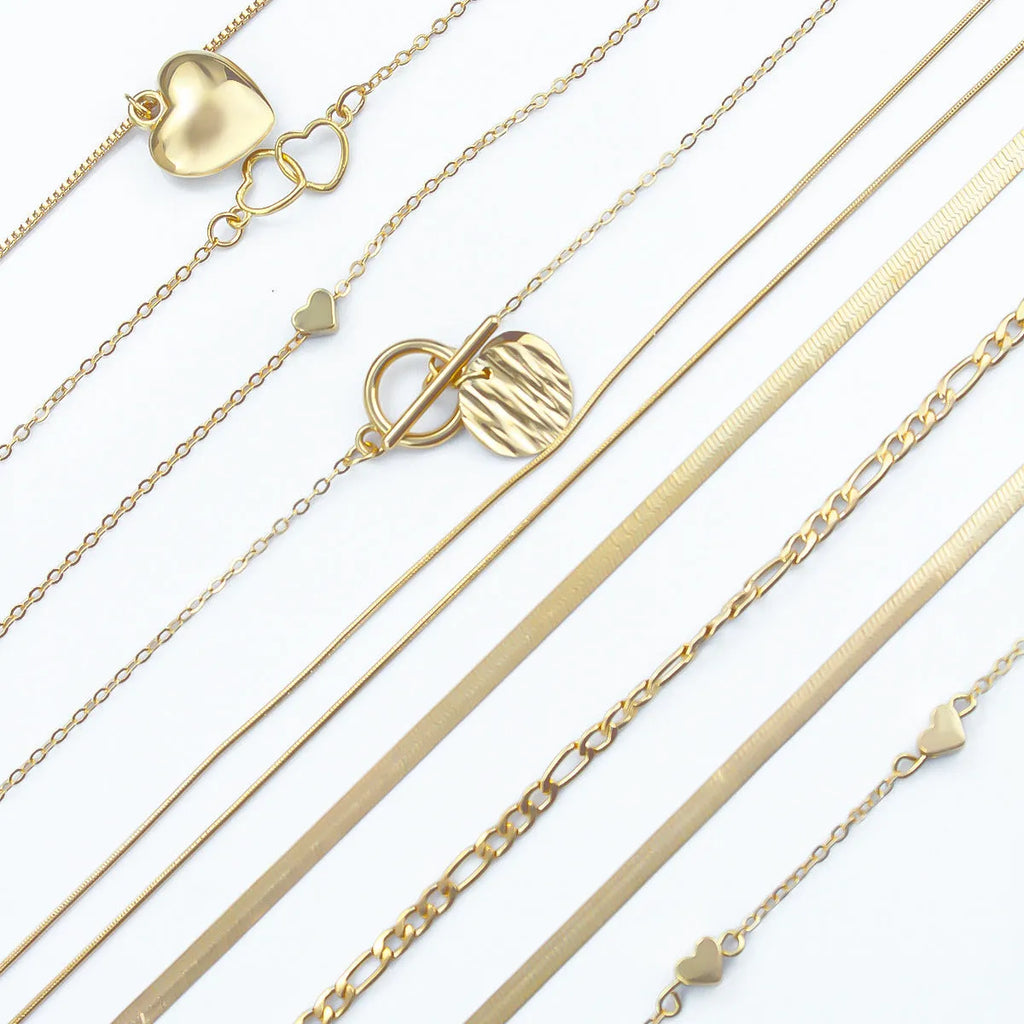 Women's gold electroplated necklace set with ten alloy pendants on adjustable snake bones chain
