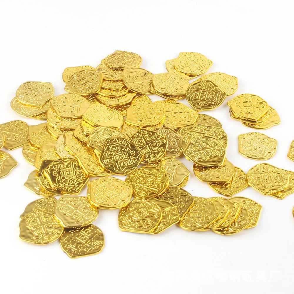 Three piles of plastic Roman coins replica in bronze, gold and silver finishes for pirate treasure decoration