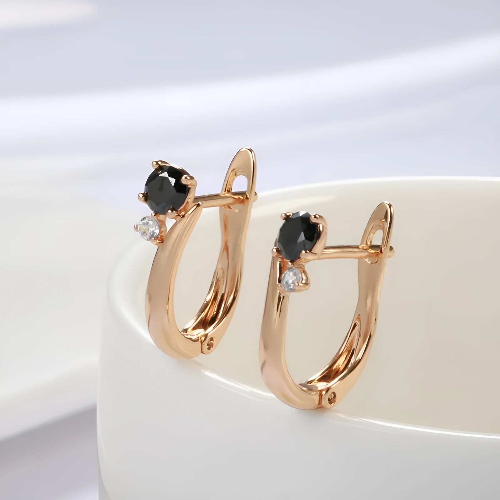 Women's black agate earrings with gold-plated finish and geometric drop shape design